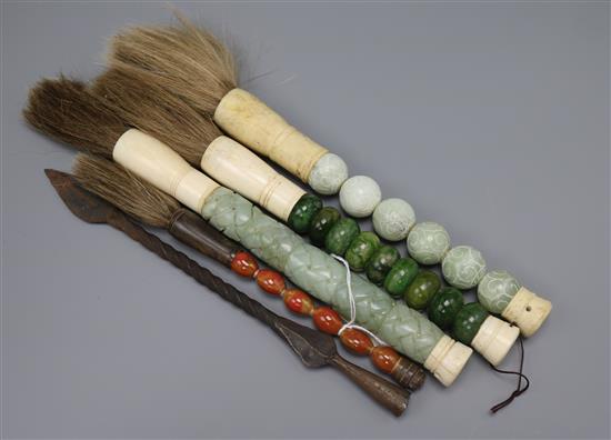 Four calligraphy brushes and a spear head
